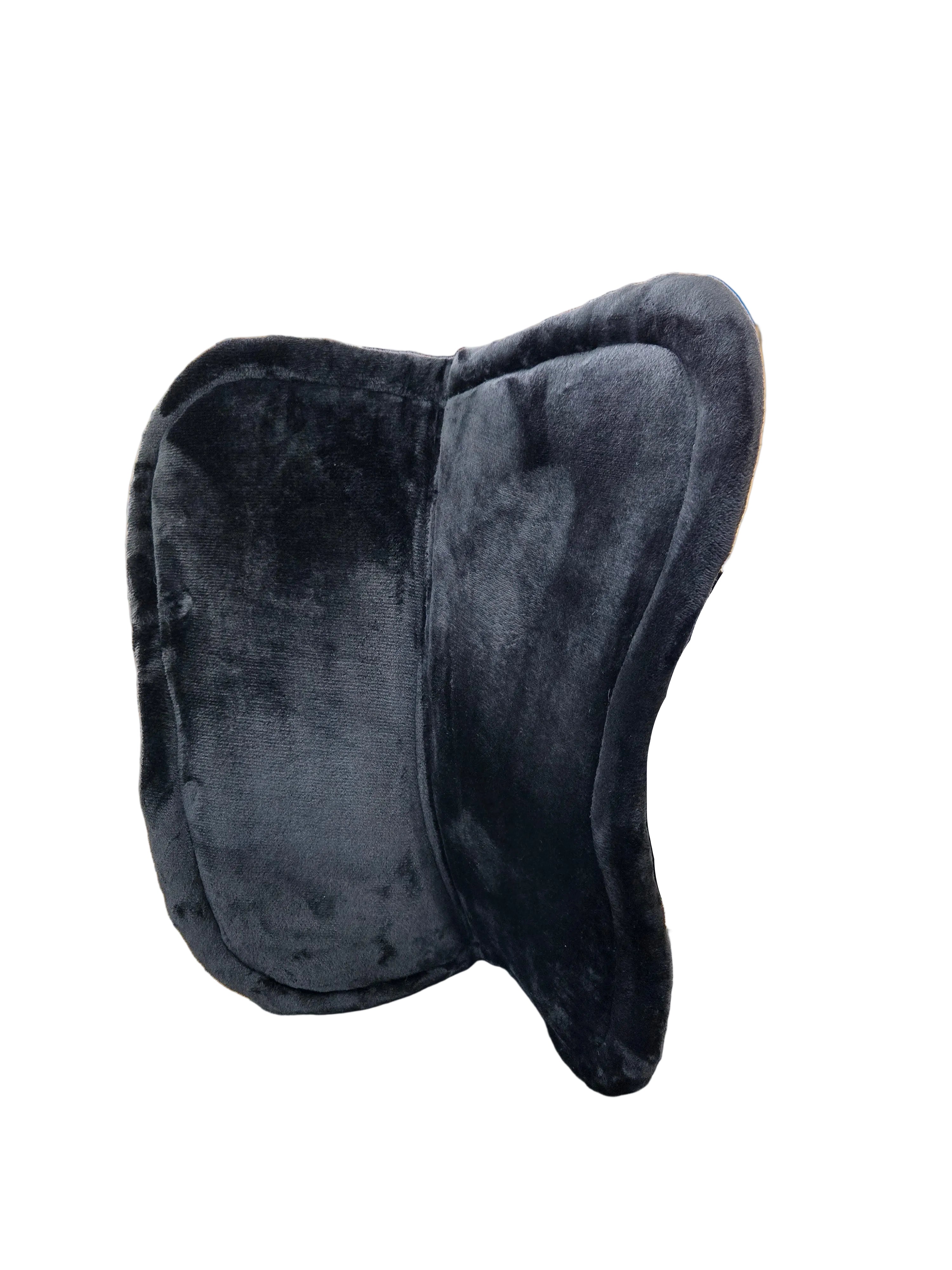 Black saddle on a stand against a tiled wall
